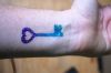 glitter key tattoo